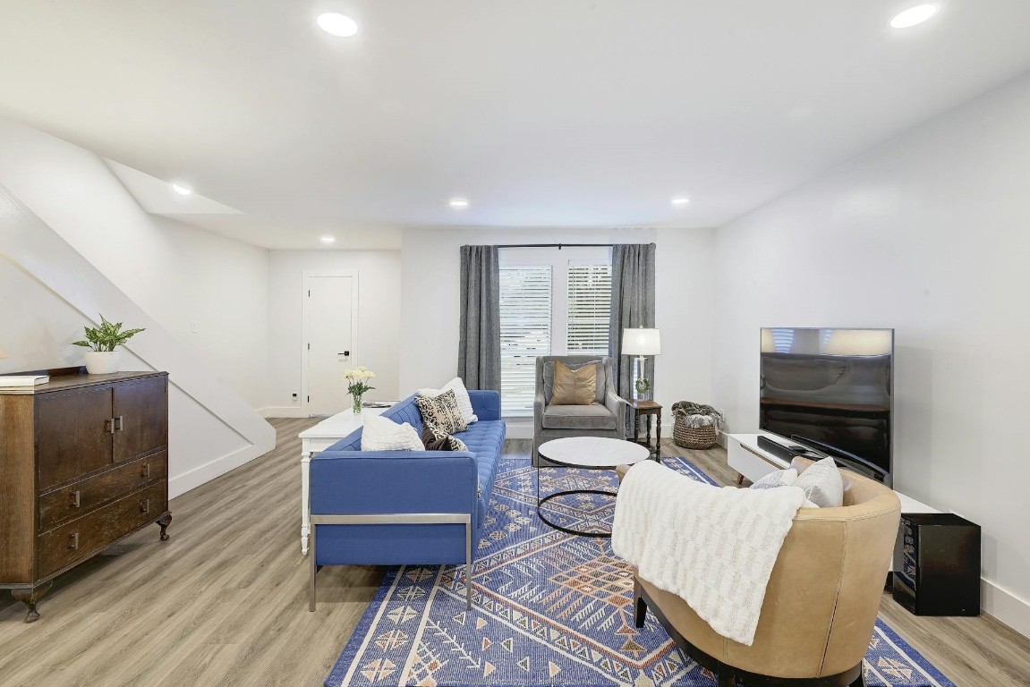 702 Castle Ridge Road, Unit B Austin, TX 78746 - Photo 6 of 23 a living room with furniture and a flat screen tv