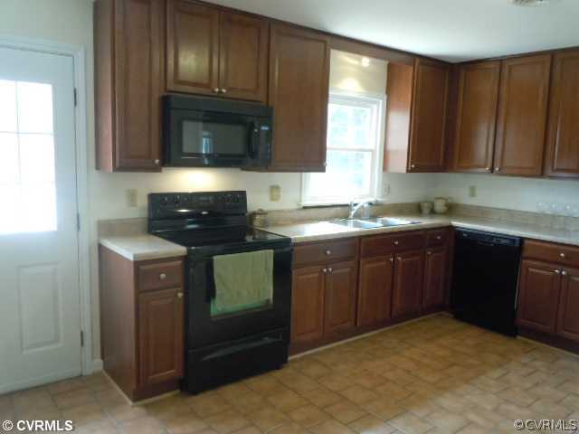 10307 Carlow Road Chesterfield, VA 23838 - Photo 3 of 12 a kitchen with a sink a stove and cabinets