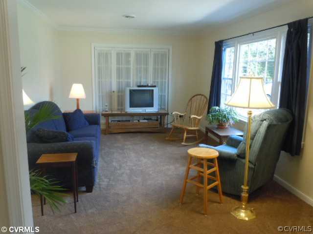 10307 Carlow Road Chesterfield, VA 23838 - Photo 8 of 12 a living room with furniture a dining table and a lamp