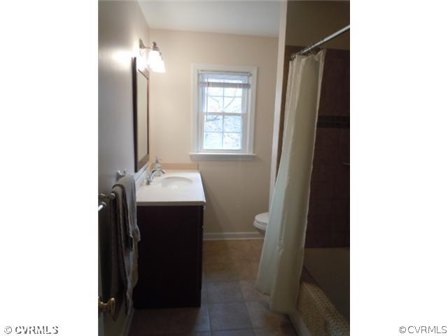 10307 Carlow Road Chesterfield, VA 23838 - Photo 9 of 12 a bathroom with a sink and a mirror