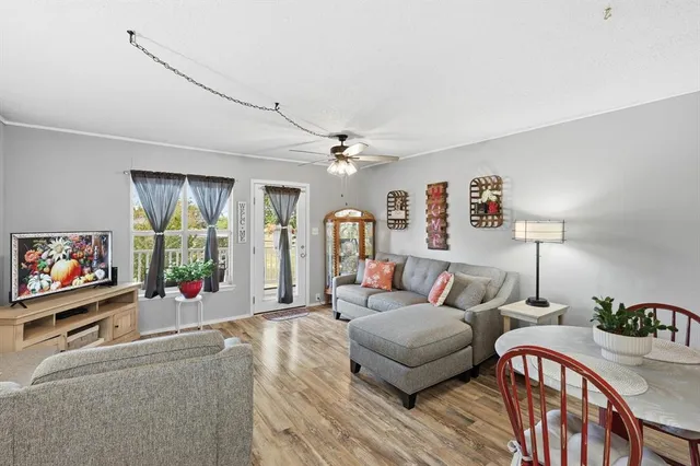 a kitchen with sink a refrigerator and cabinets