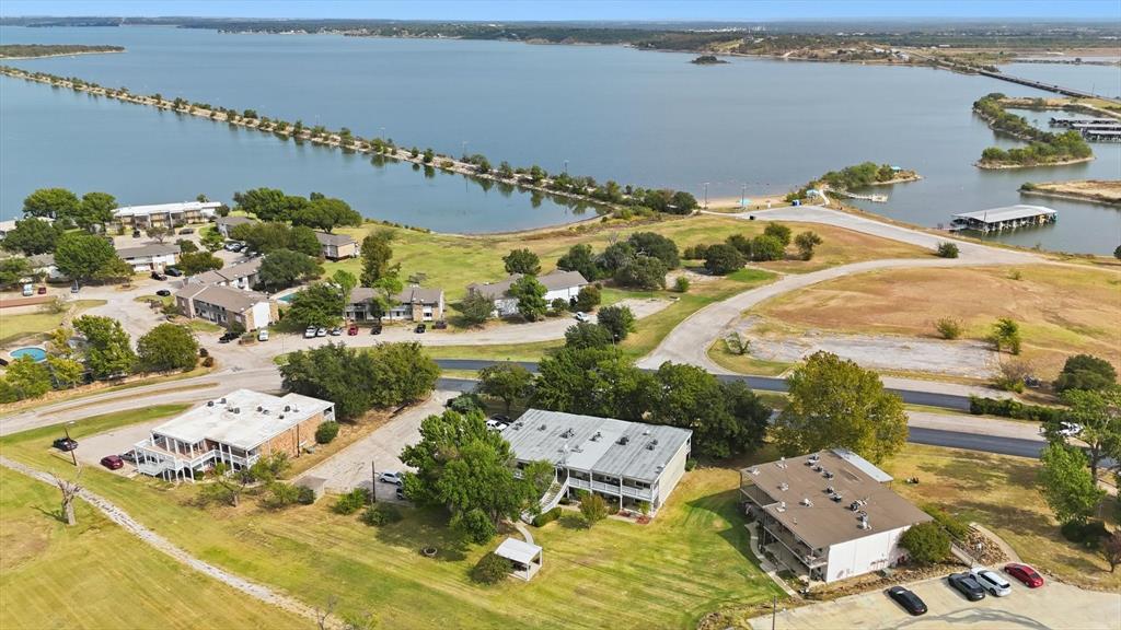 81 Runaway Bay Drive, Unit 220 Runaway Bay, TX 76426 - Photo 22 of 32 an aerial view of a house with outdoor space