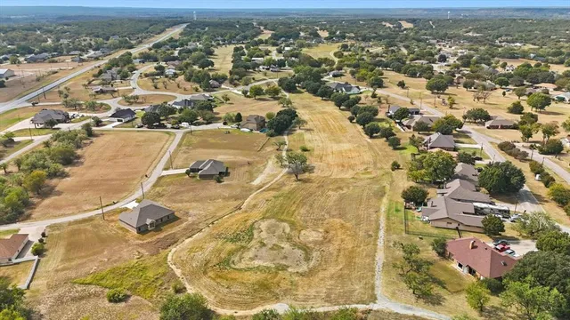 an aerial view of a house with outdoor space
