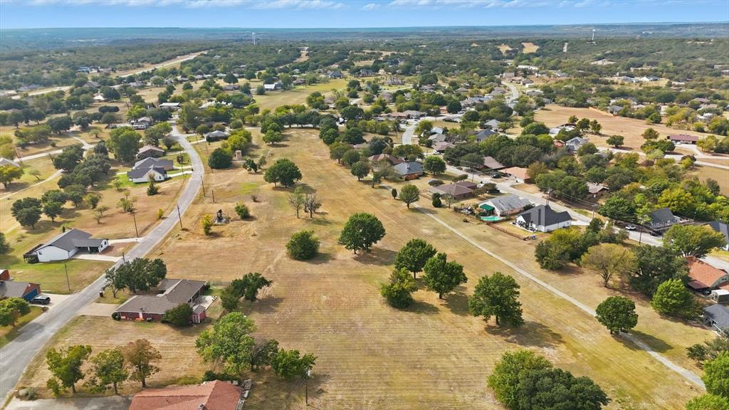 81 Runaway Bay Drive, Unit 220 Runaway Bay, TX 76426 - Photo 25 of 32 an aerial view of residential houses with outdoor space