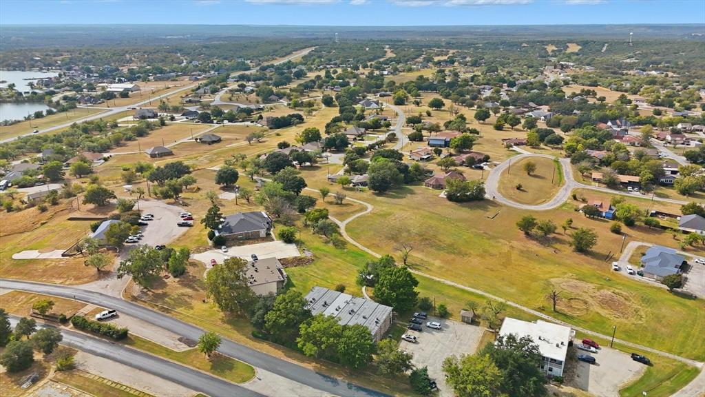 81 Runaway Bay Drive, Unit 220 Runaway Bay, TX 76426 - Photo 26 of 32 an aerial view of residential houses with outdoor space