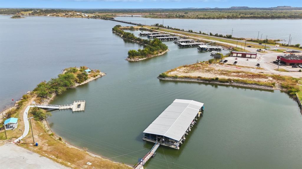 81 Runaway Bay Drive, Unit 220 Runaway Bay, TX 76426 - Photo 28 of 32 a view of a room with gym equipment