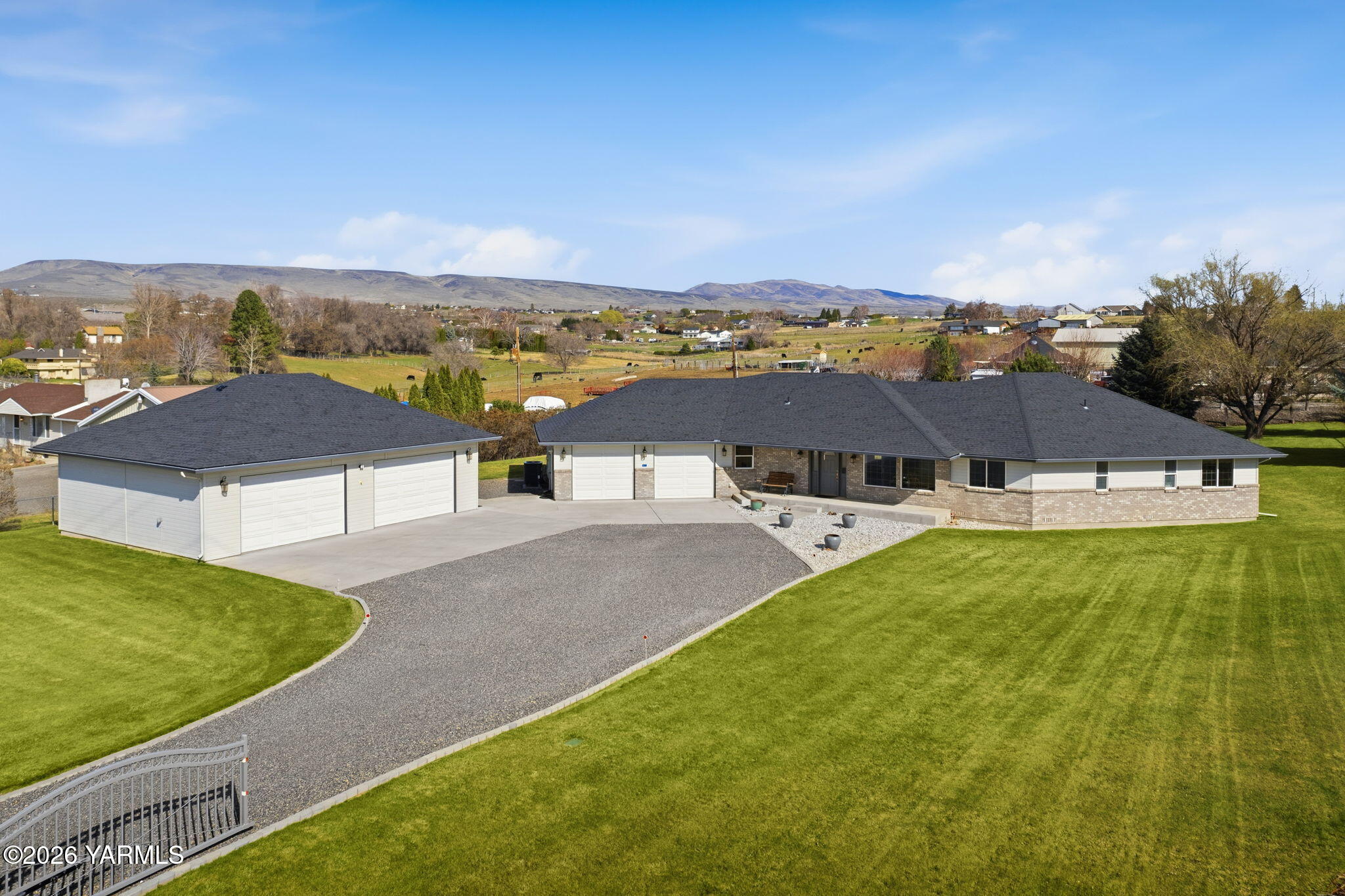 461 White Road Yakima, WA 98901 - Photo 2 of 36 an aerial view of residential houses with outdoor space and trees