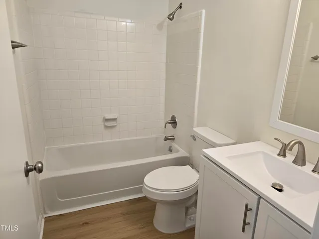 a bathroom with a sink a toilet and a bathtub