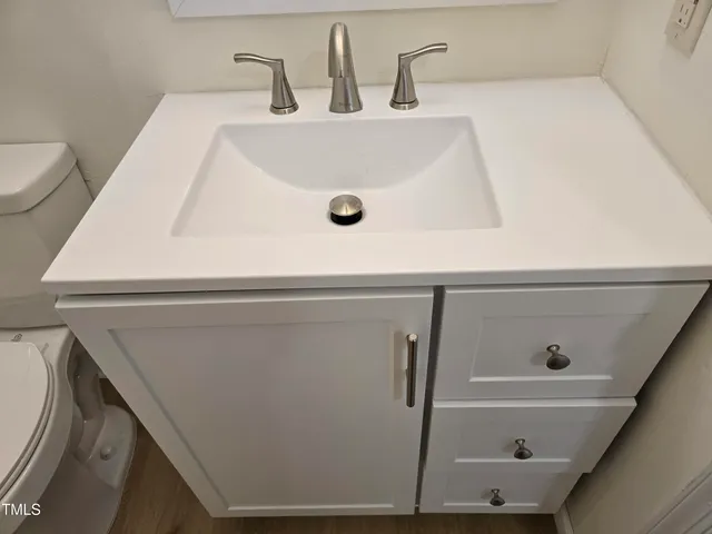 a bathroom with a sink and mirror