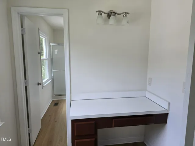 a bathroom with a sink and vanity