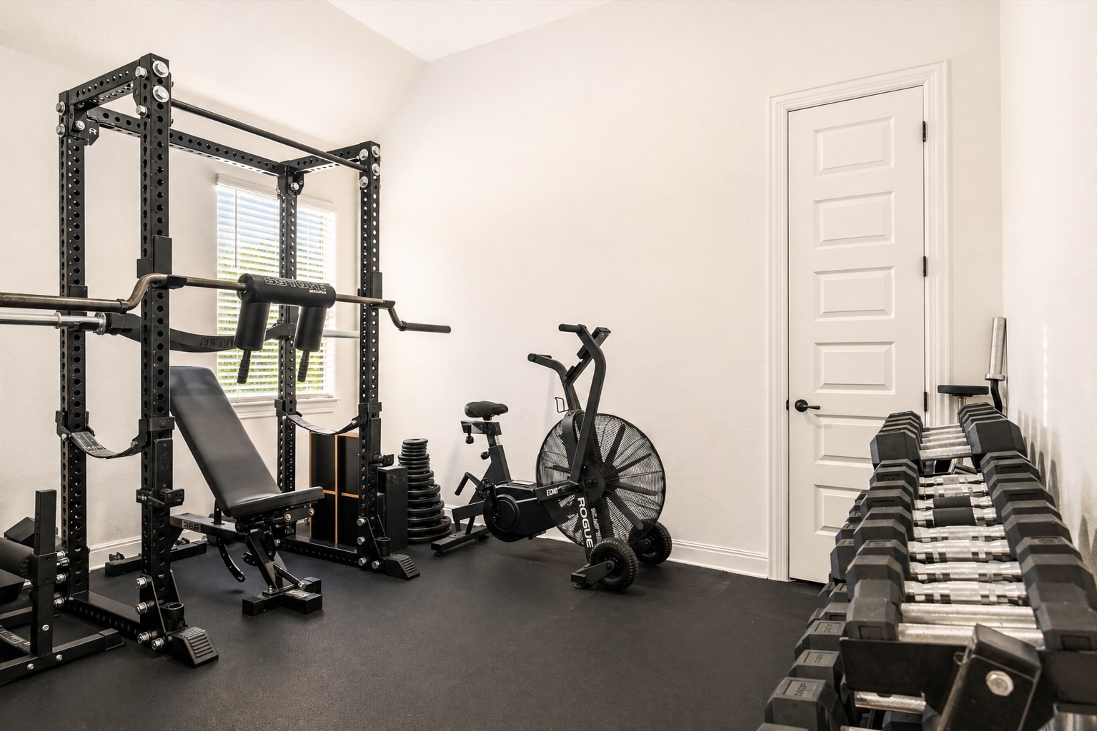209 Rainier Drive Kyle, TX 78640 - Photo 6 of 24 Dedicated fitness space featuring rubber flooring, a single window with blinds, and clean white walls