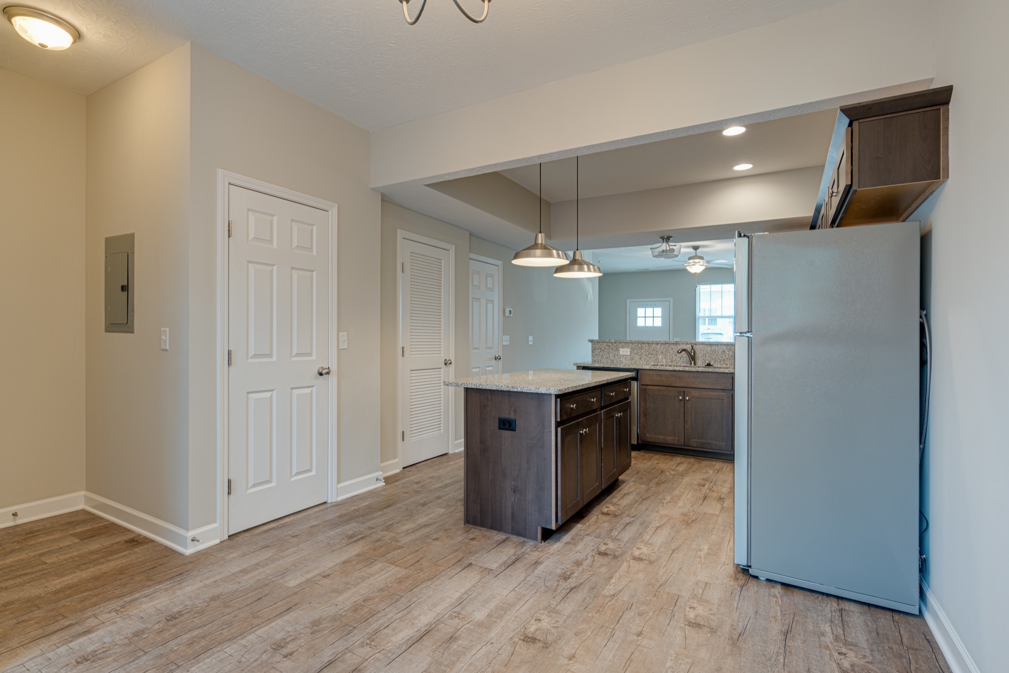 1382 Rural Hill Road, Unit 384 Antioch, TN 37013 - Photo 11 of 28 a large kitchen with a wooden floor and a sink