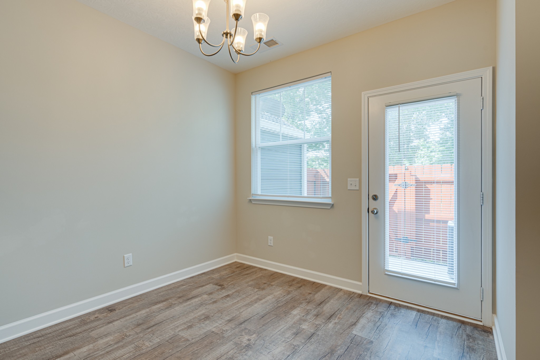 1382 Rural Hill Road, Unit 384 Antioch, TN 37013 - Photo 12 of 28 an empty room with wooden floor and windows