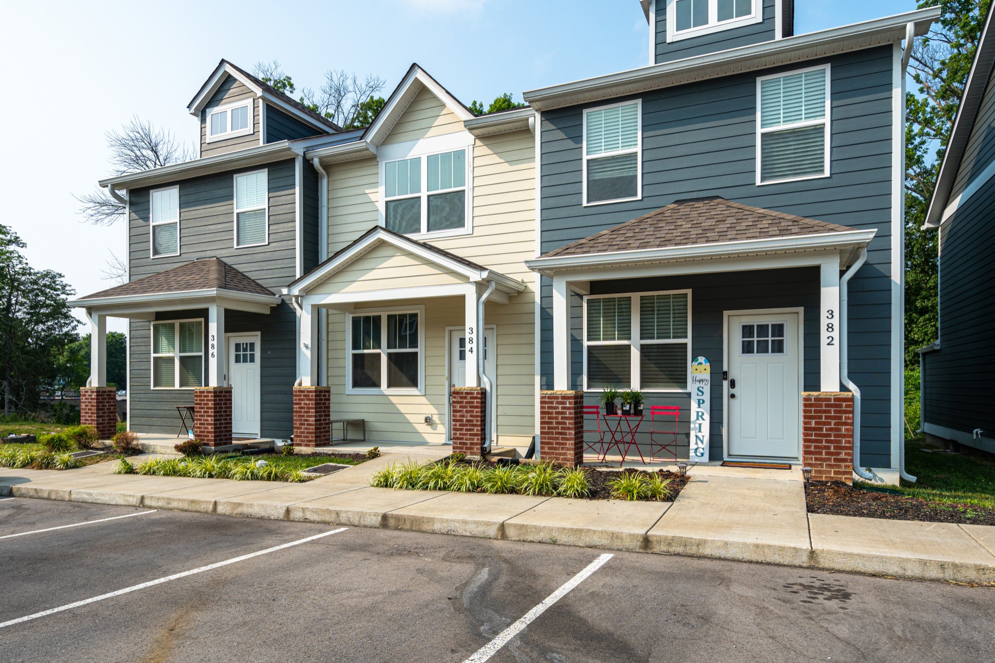 1382 Rural Hill Road, Unit 384 Antioch, TN 37013 - Photo 5 of 28 a front view of a house with a yard and outdoor seating