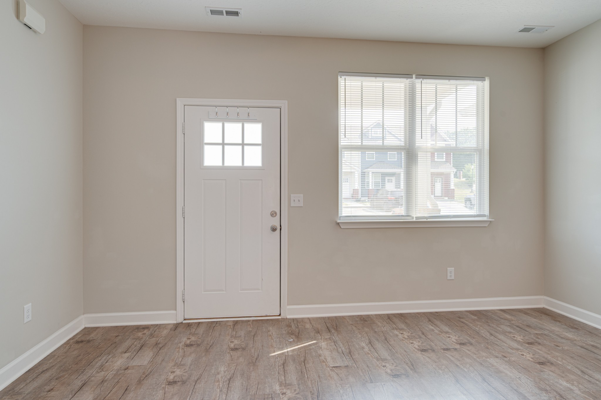 1382 Rural Hill Road, Unit 384 Antioch, TN 37013 - Photo 7 of 28 an empty room with wooden floor and windows