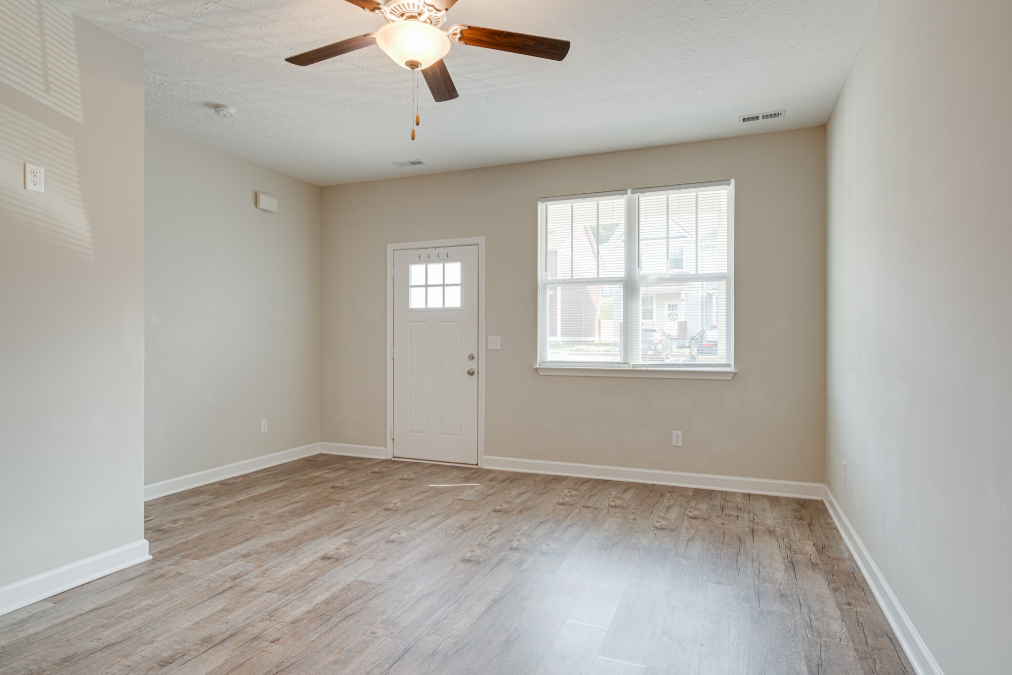 1382 Rural Hill Road, Unit 384 Antioch, TN 37013 - Photo 8 of 28 wooden floor in an empty room with a window