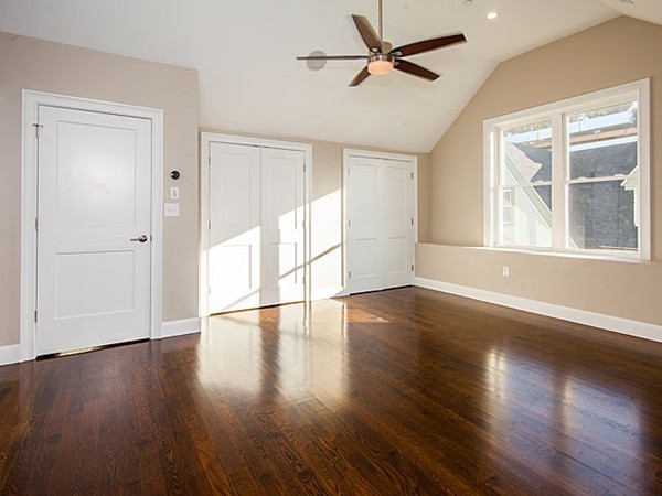 884 Adams Street, Unit 4 Boston, MA 02124 - Photo 17 of 27 a view of empty room with wooden floor and fan