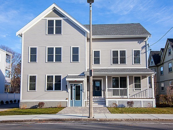 884 Adams Street, Unit 4 Boston, MA 02124 - Photo 21 of 27 a front view of a house with a yard