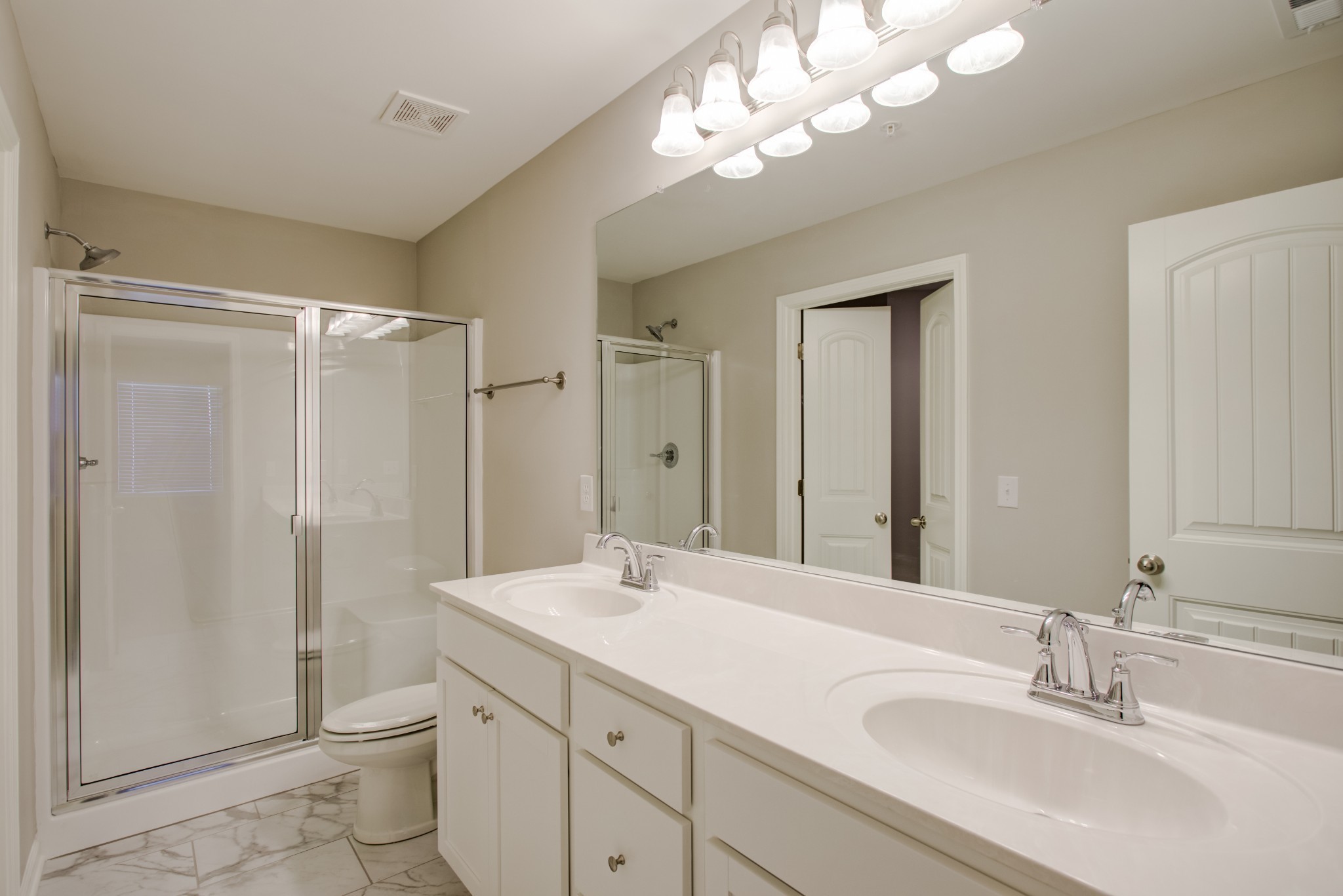 172 Grand Avenue Spring Hill, TN 37174 - Photo 6 of 11 a bathroom with a double vanity sink mirror and toilet