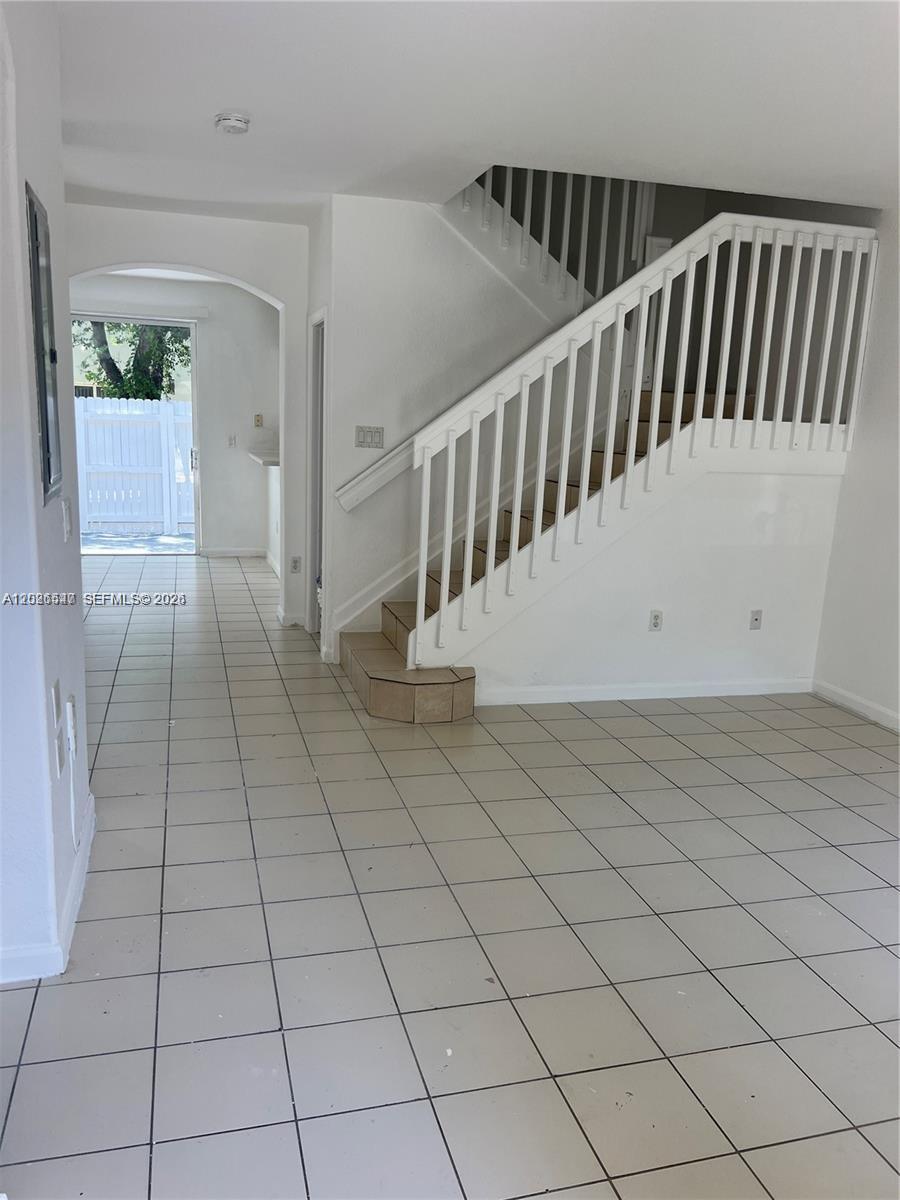 2910 Southeast 15th Road, Unit 55 Homestead, FL 33035 - Photo 4 of 13 a view of a hallway with entryway