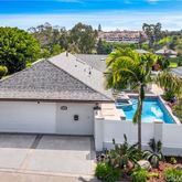 an aerial view of a house with a swimming pool