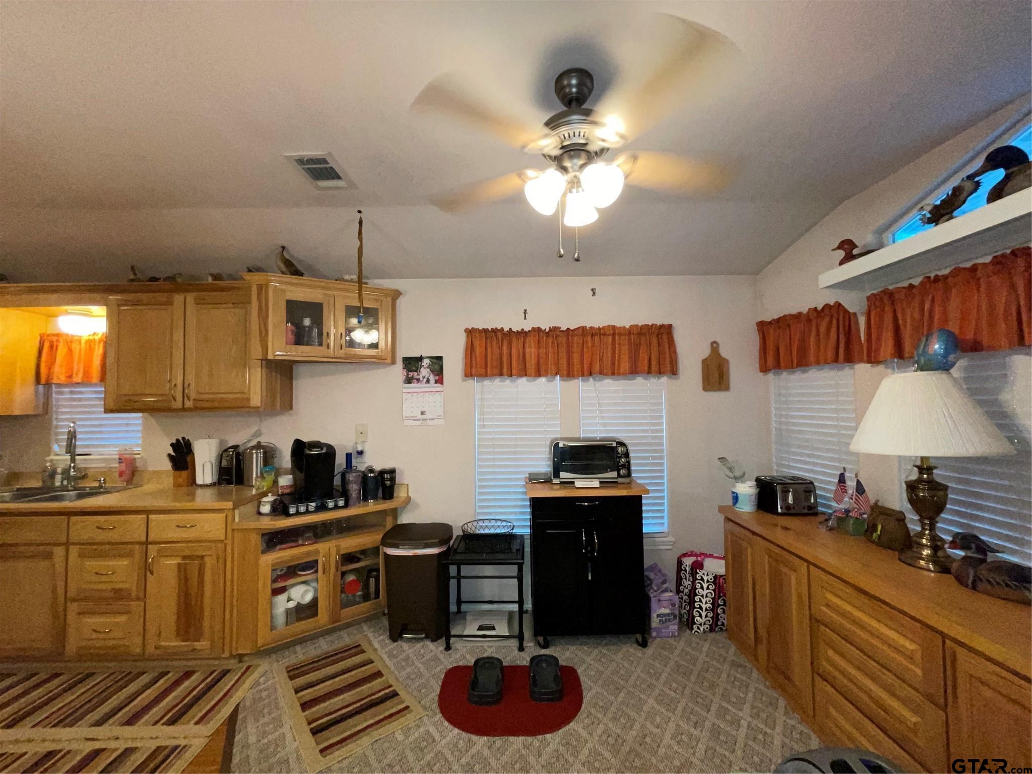6435 FM 17 Yantis, TX 75497 - Photo 14 of 23 a kitchen with stainless steel appliances a sink stove and cabinets