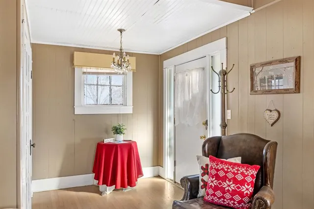 a livingroom with furniture and a flat screen tv