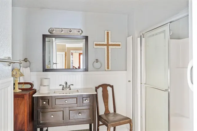 a bedroom with a bed next to a window with the outer view