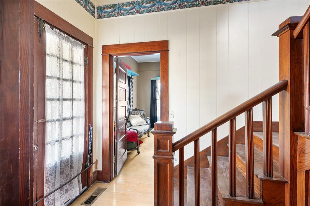 308 Race Street Baird, TX 79504 - Photo 3 of 27 Entryway with stairway and light wood-style flooring