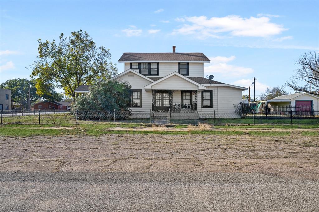 308 Race Street Baird, TX 79504 - Photo 4 of 27 View of front of property with covered porch and a fenced front yard