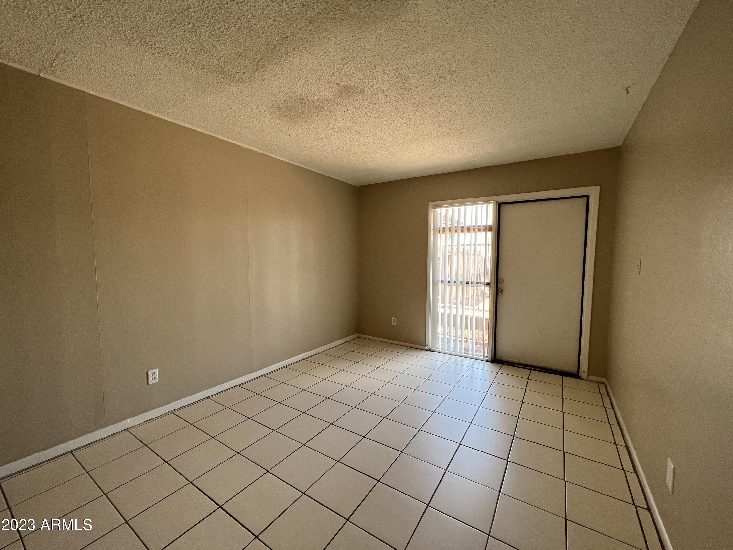26 West 6th Place, Unit 3 Mesa, AZ 85201 - Photo 4 of 11 a view of an empty room and window