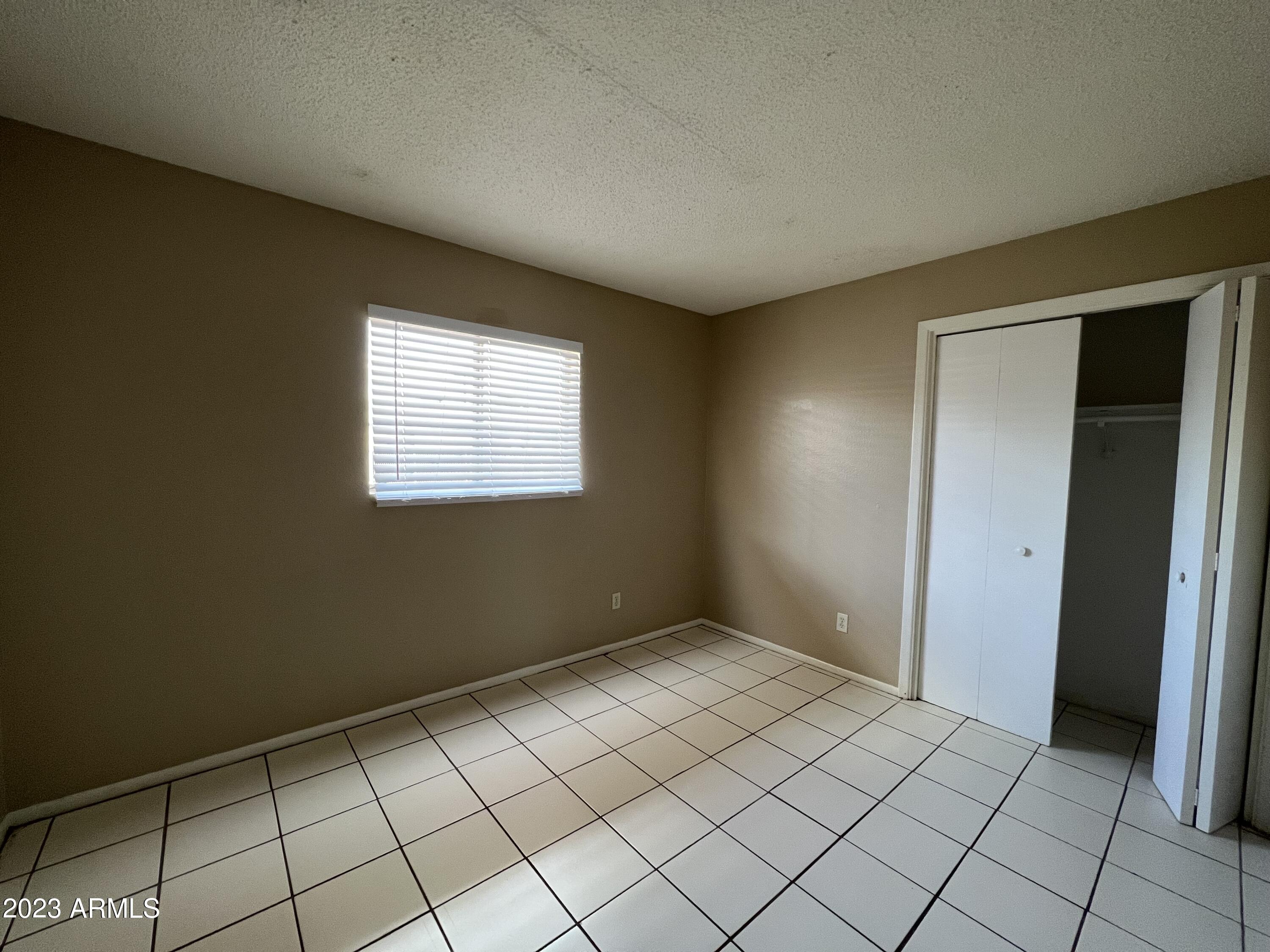 26 West 6th Place, Unit 3 Mesa, AZ 85201 - Photo 8 of 11 a view of an empty room and window