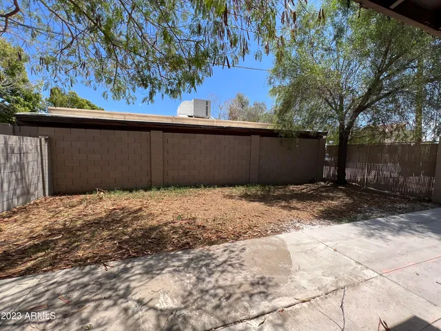 a view of a backyard of the house