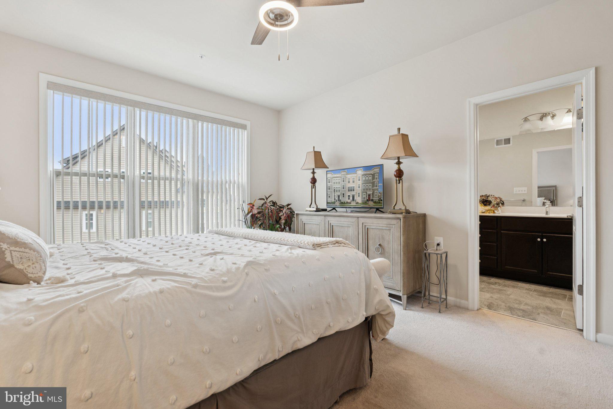 969 Holden Road Frederick, MD 21701 - Photo 12 of 35 a bedroom with a bed and a large window