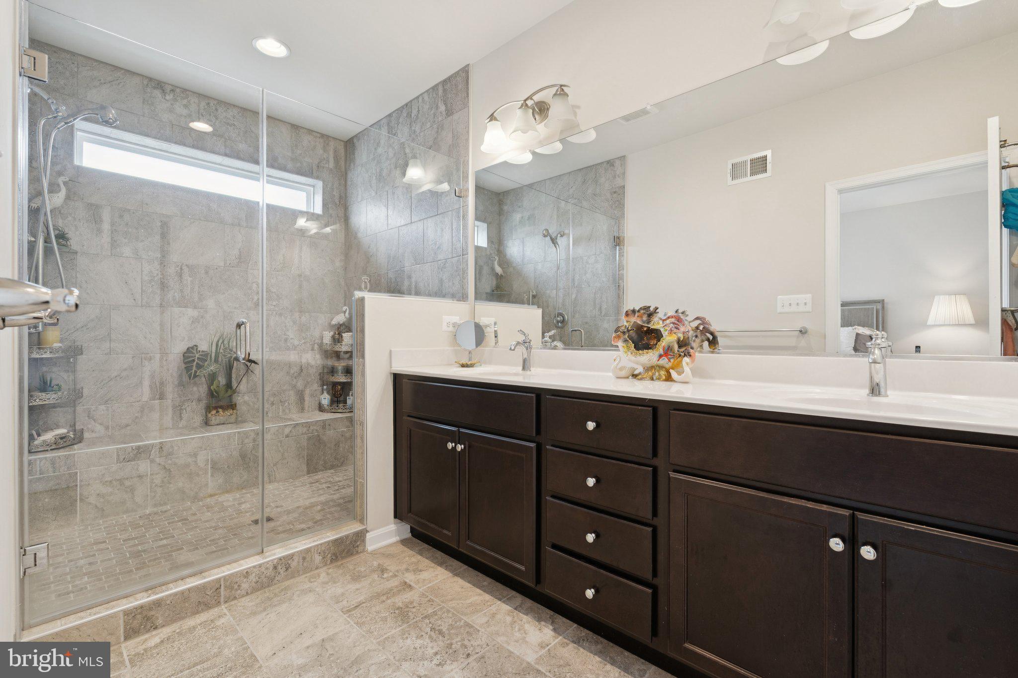 969 Holden Road Frederick, MD 21701 - Photo 13 of 35 a bathroom with a sink double vanity and shower