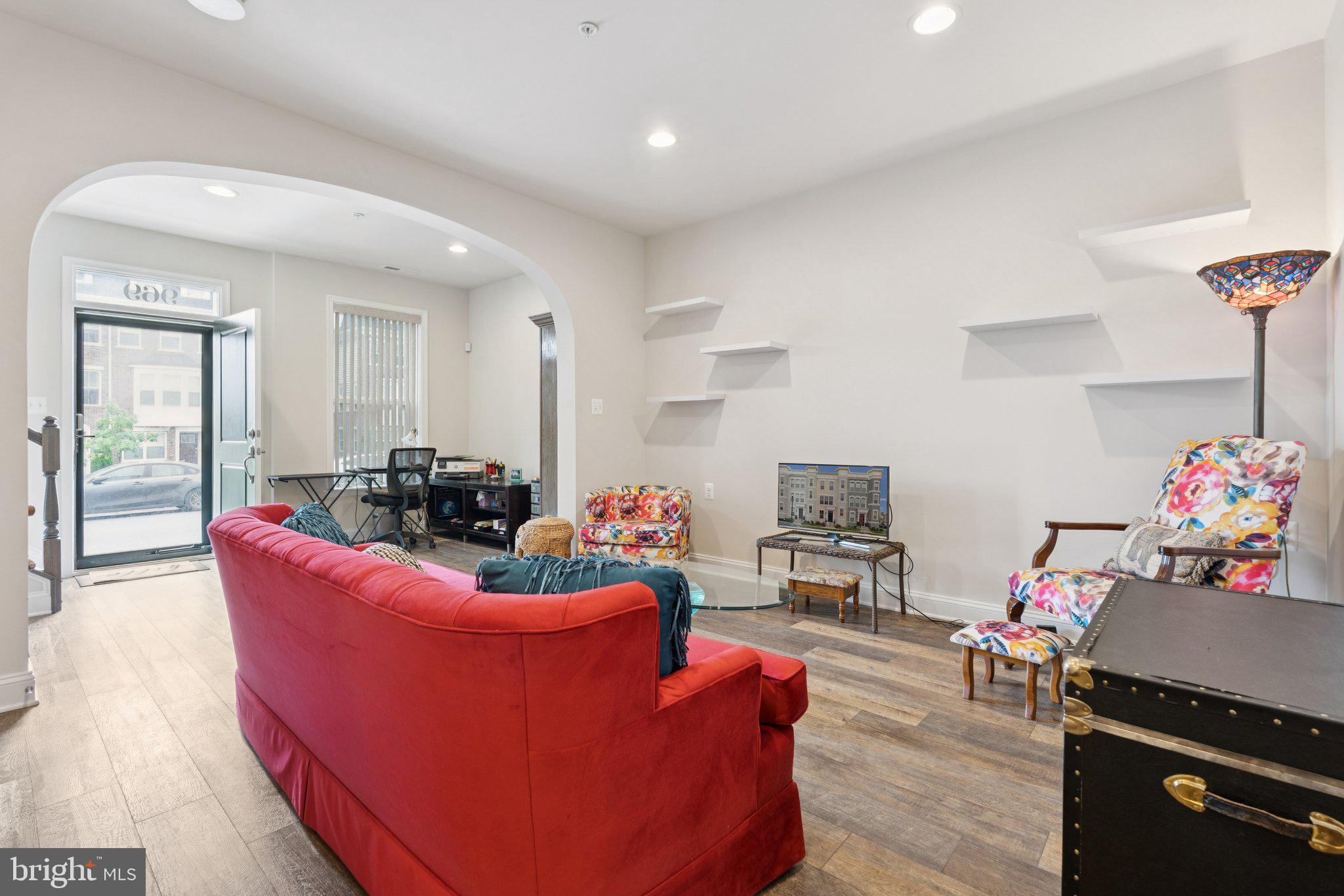 969 Holden Road Frederick, MD 21701 - Photo 17 of 35 a living room with furniture and a fireplace