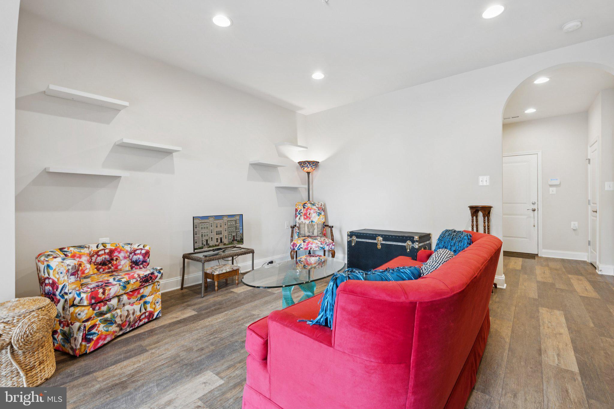 969 Holden Road Frederick, MD 21701 - Photo 18 of 35 a living room with furniture and a wooden floor