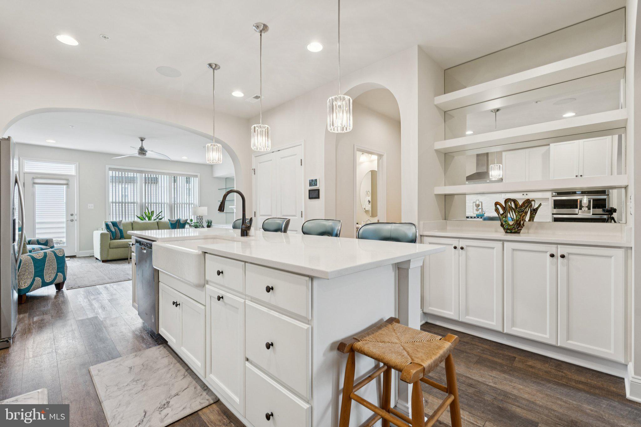 969 Holden Road Frederick, MD 21701 - Photo 2 of 35 a kitchen with white cabinets and sink