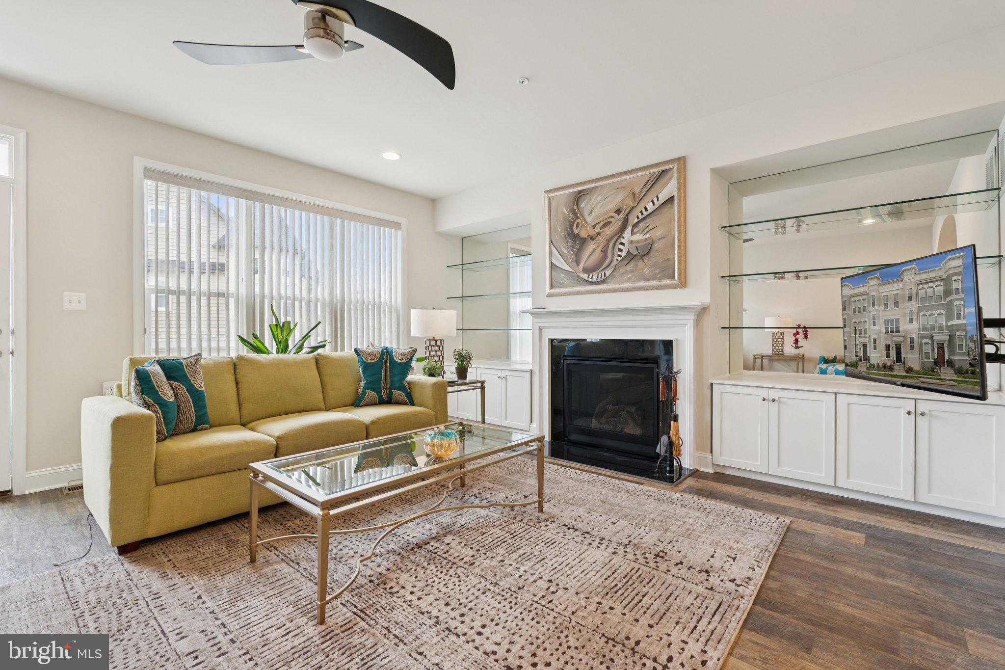 969 Holden Road Frederick, MD 21701 - Photo 4 of 35 a living room with furniture and a fireplace
