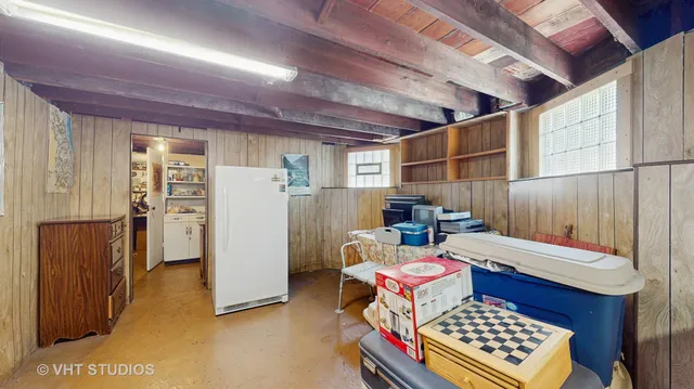 a room with furniture a rug and a window