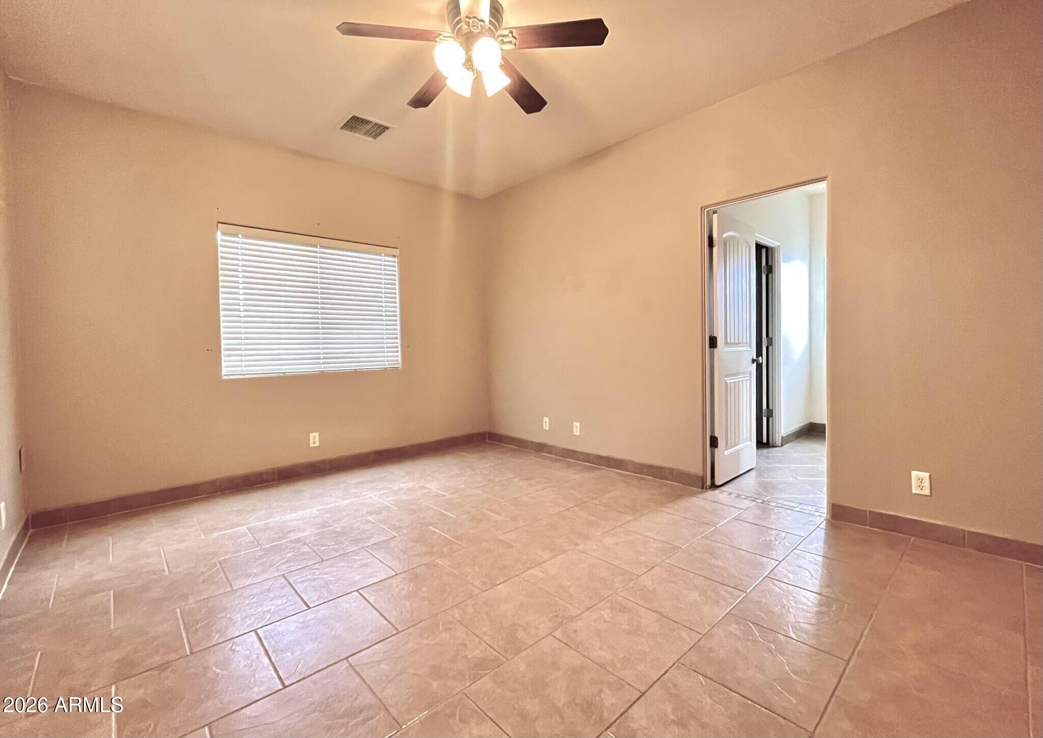 5655 North Laura Lane Rimrock, AZ 86335 - Photo 14 of 37 a view of an empty room with a window