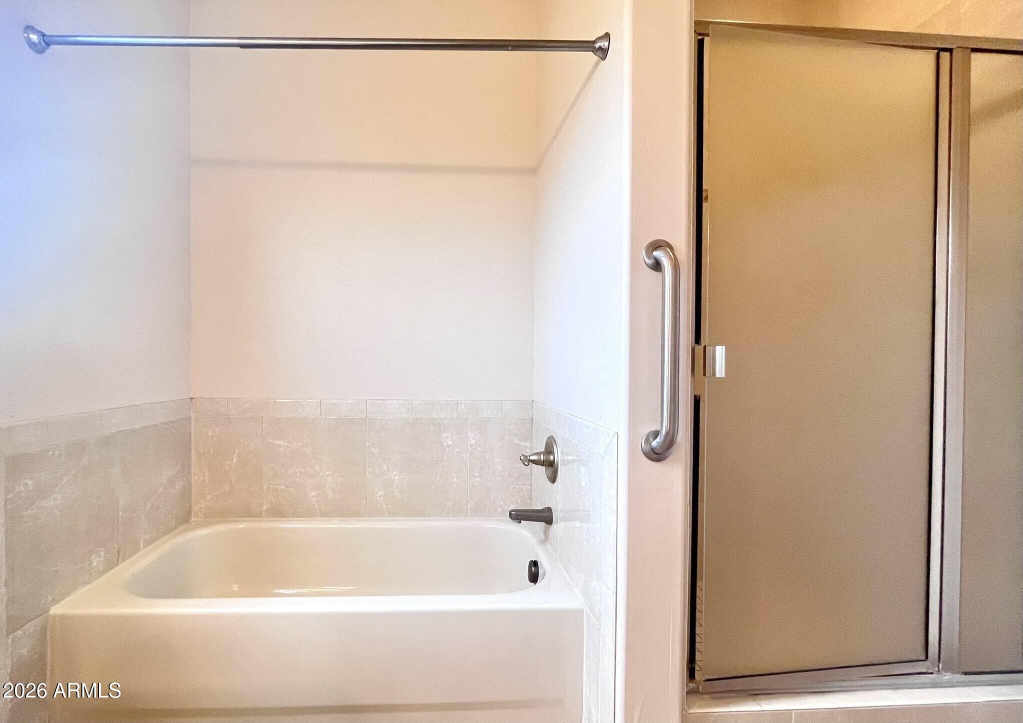 5655 North Laura Lane Rimrock, AZ 86335 - Photo 17 of 37 a bathroom with a shower and a bath tub