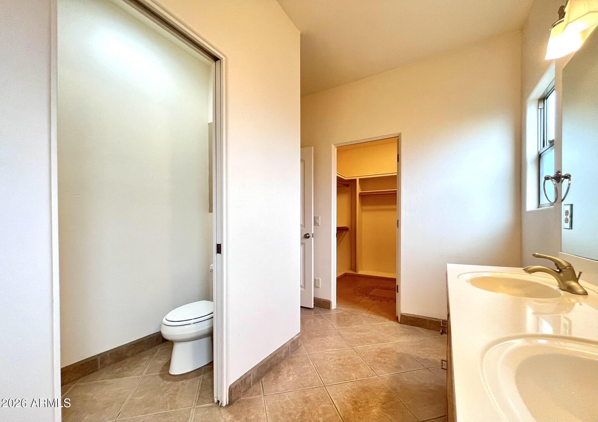 5655 North Laura Lane Rimrock, AZ 86335 - Photo 18 of 37 a bathroom with a granite countertop toilet and a sink