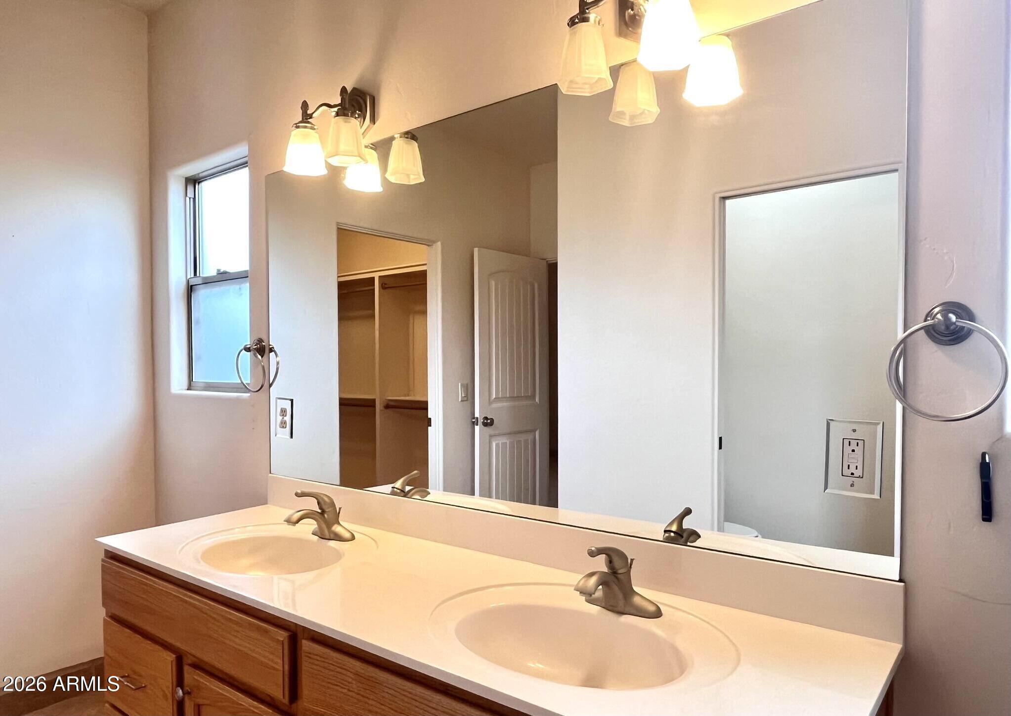 5655 North Laura Lane Rimrock, AZ 86335 - Photo 19 of 37 a bathroom with a sink a vanity and a mirror