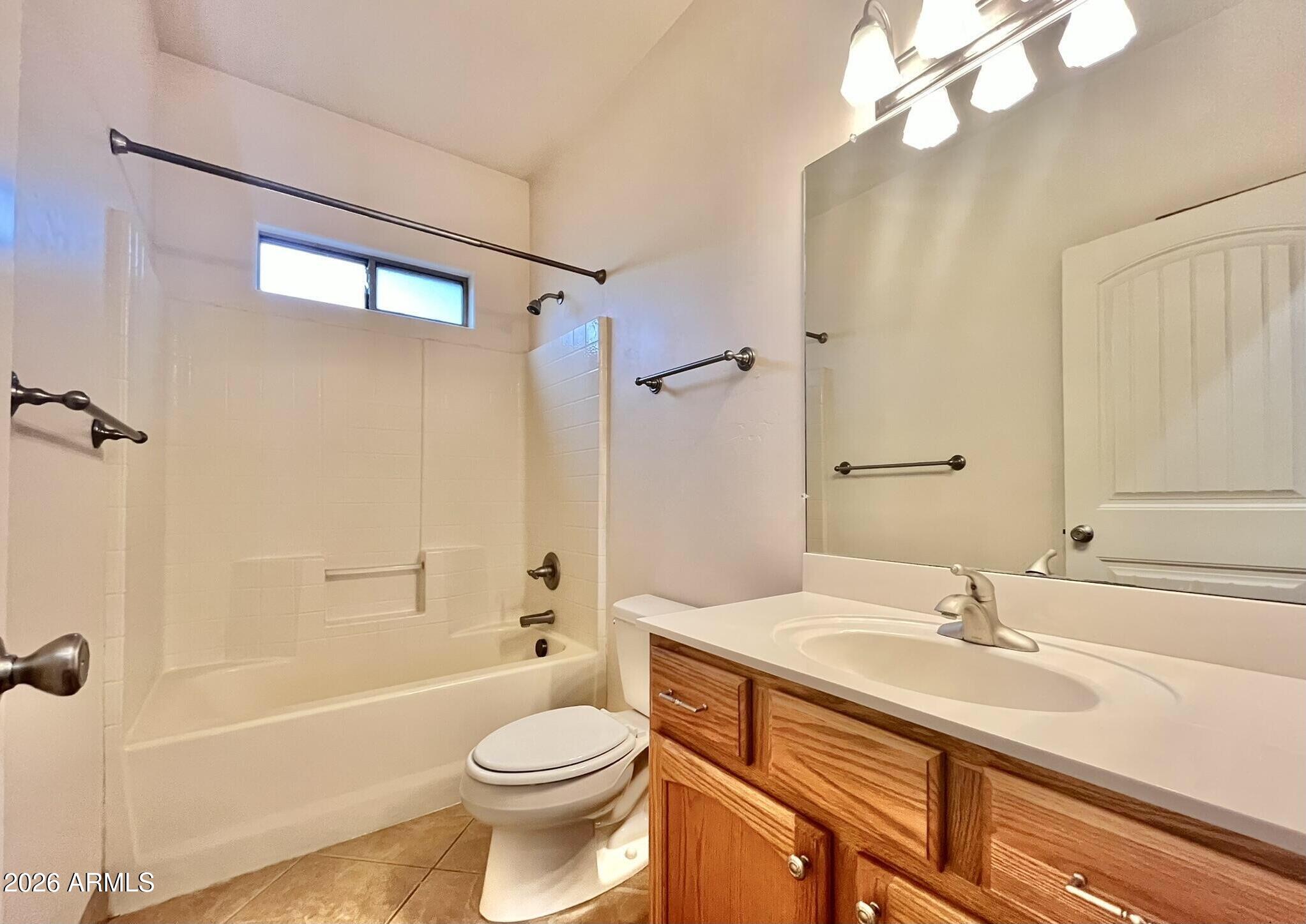 5655 North Laura Lane Rimrock, AZ 86335 - Photo 23 of 37 a bathroom with a sink a toilet a mirror and shower