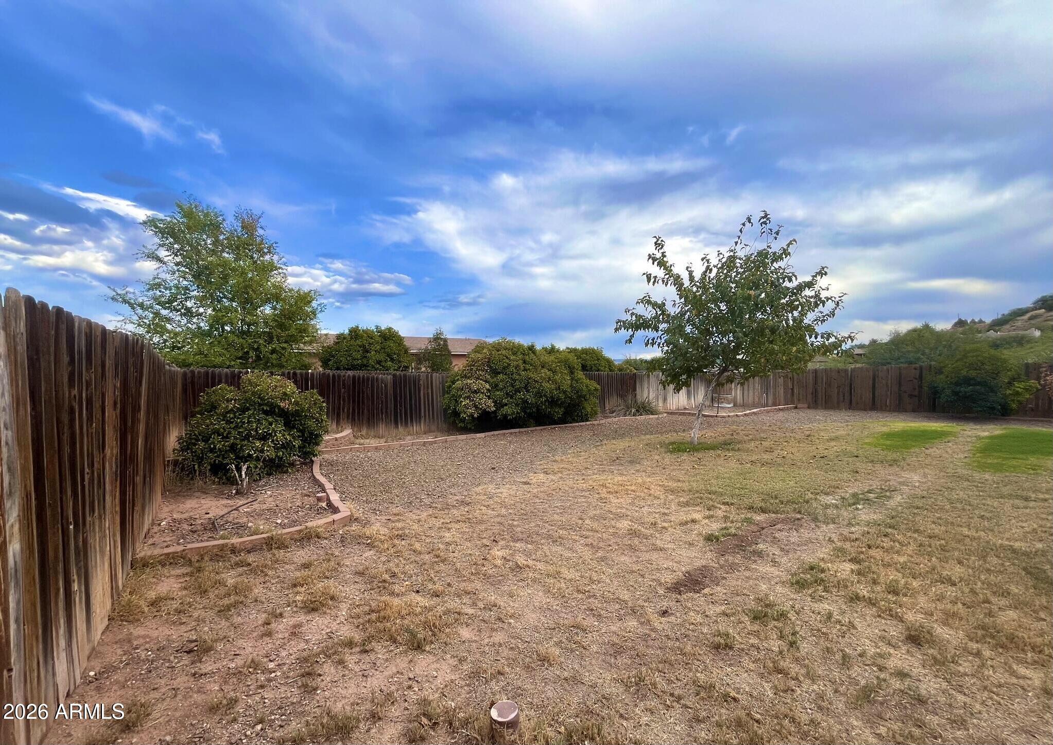 5655 North Laura Lane Rimrock, AZ 86335 - Photo 34 of 37 a backyard of a house with lots of green space