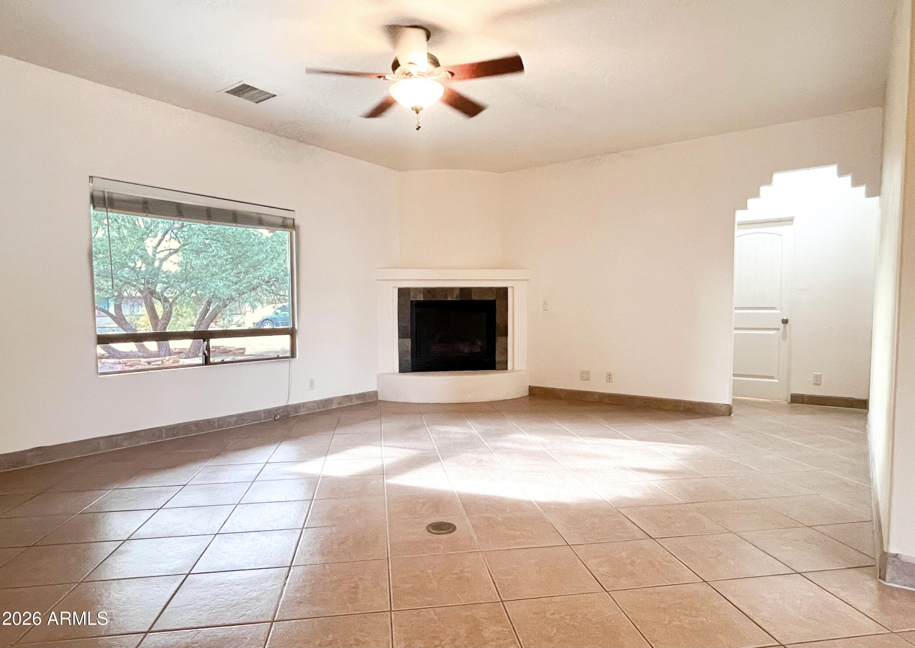 5655 North Laura Lane Rimrock, AZ 86335 - Photo 4 of 37 a view of an empty room with a window