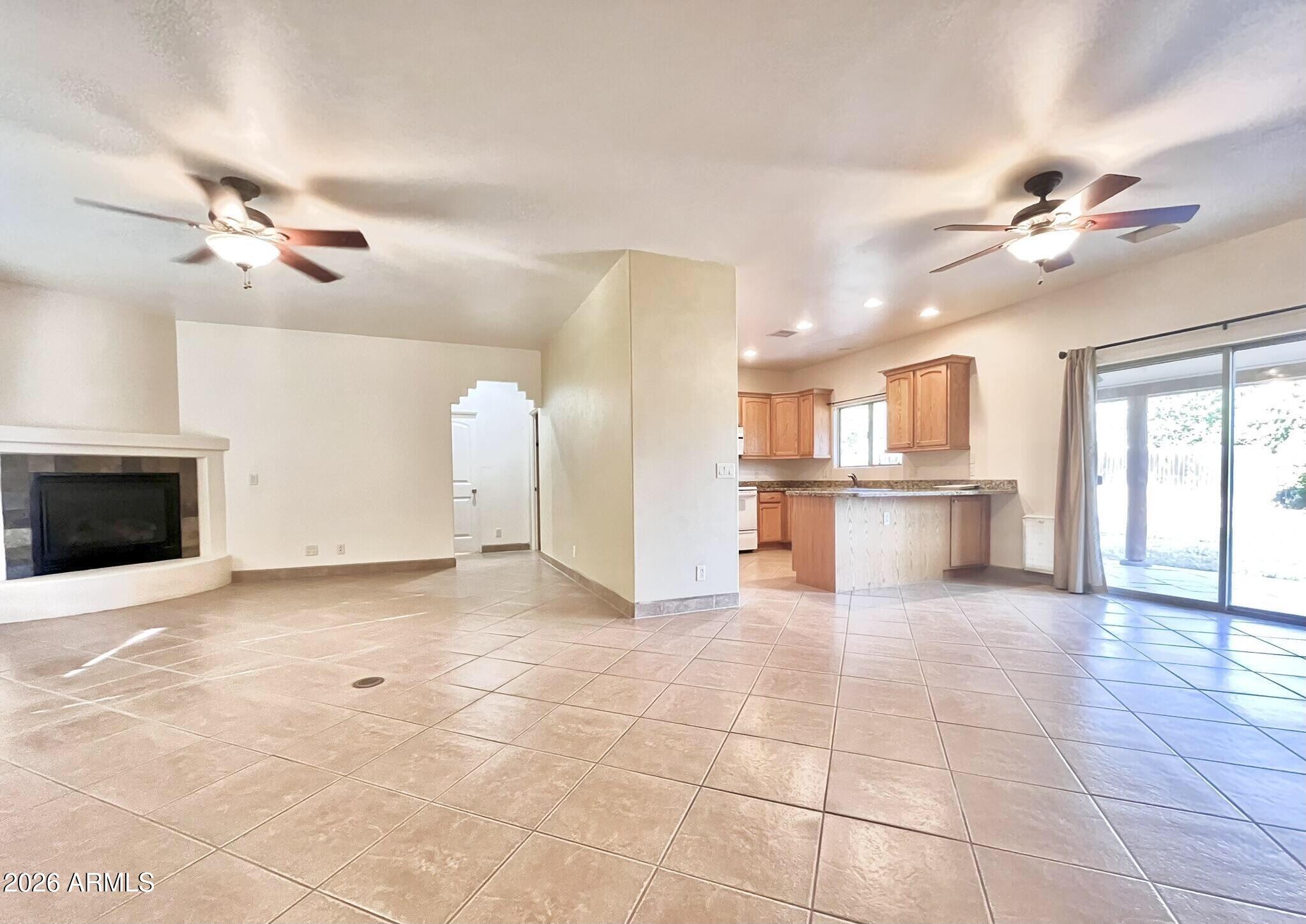 5655 North Laura Lane Rimrock, AZ 86335 - Photo 5 of 37 a view of a kitchen with furniture and a ceiling fan