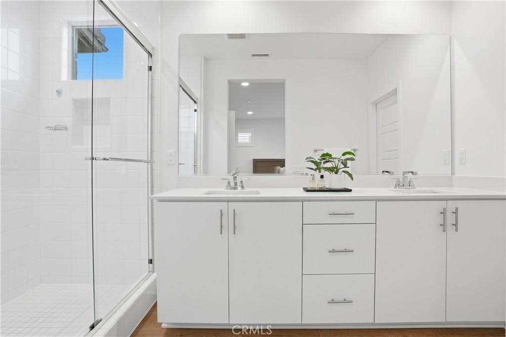 451 Potter Way Rancho Mission Viejo, CA 92694 - Photo 14 of 75 a bathroom with a sink and a mirror