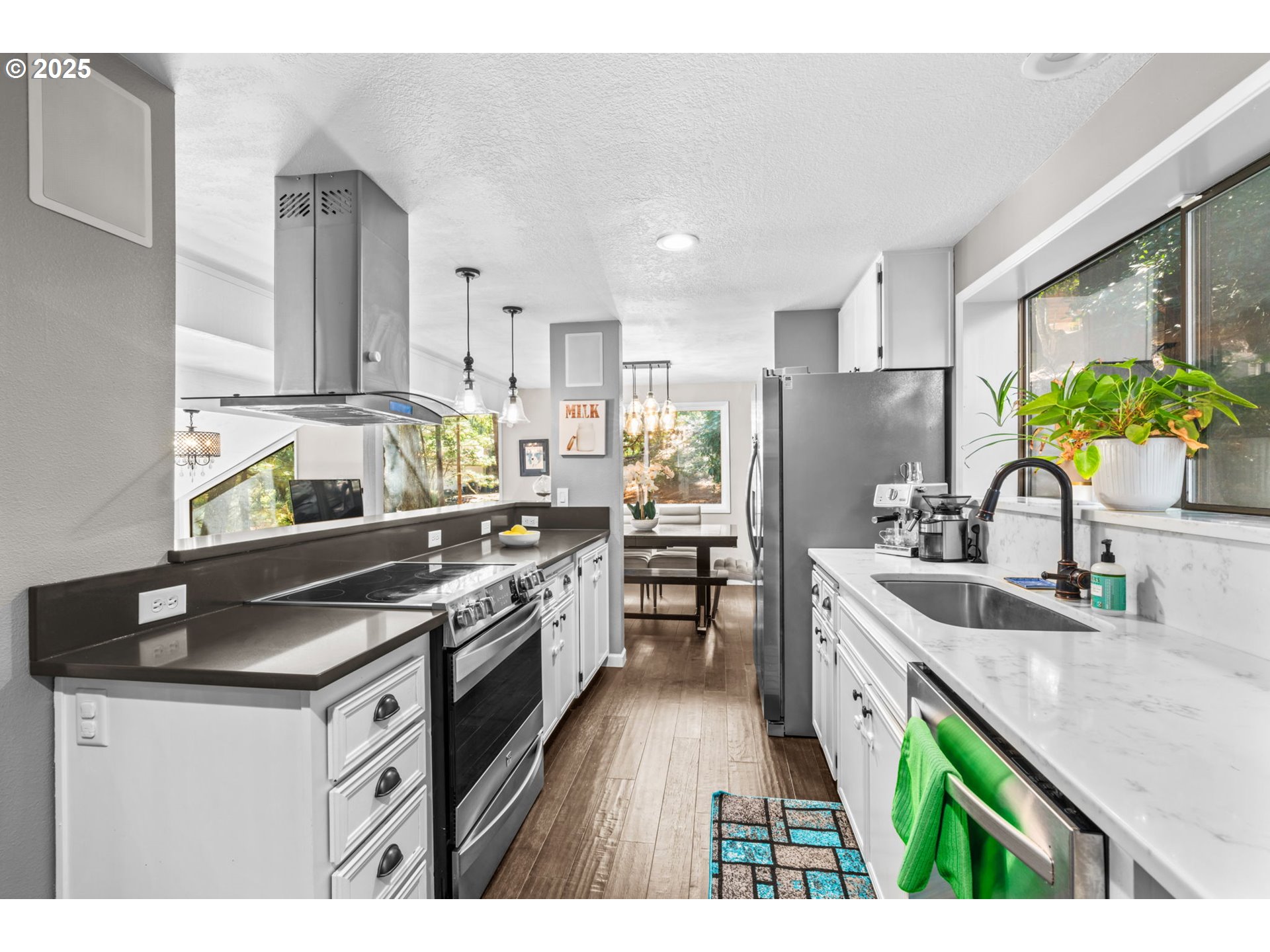 792 Brookside Drive Eugene, OR 97405 - Photo 18 of 46 a kitchen with stainless steel appliances granite countertop a sink stove and refrigerator